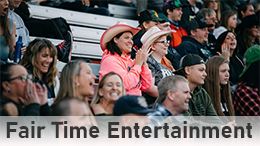 Fair Time Entertainment-people in crowd, cowboy hats on.
