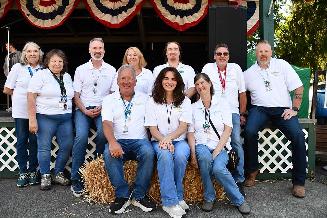 Members of the 2025 Evergreen Fair Advisory Board in front of the Courtyard Stage