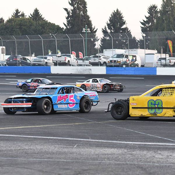 a blue and yellow figure 8 race car on track 